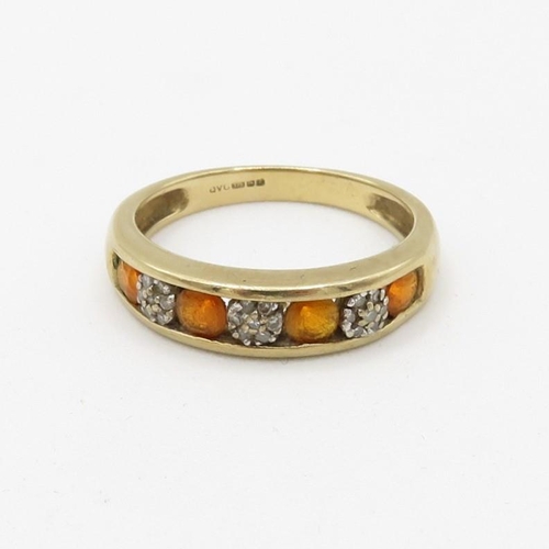 217 - 9ct gold diamond and orange gemstone seven stone eternity ring (2.3g) Size  O