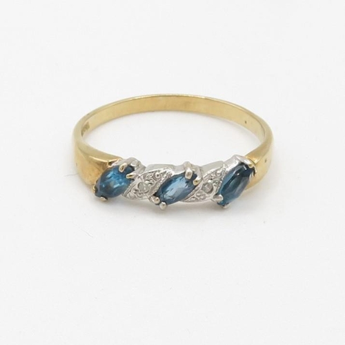 67 - 9ct gold diamond accented and blue topaz set band ring (1.8g) Size  P