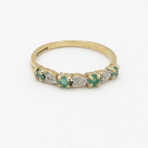 69 - 9ct gold diamond and emerald set seven stone eternity ring (1.5g) Size  P