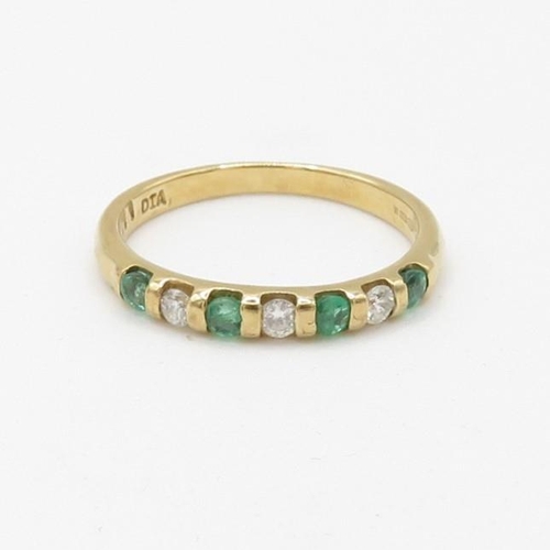 86 - 9ct gold diamond and emerald set seven stone eternity ring (1.6g) Size  L