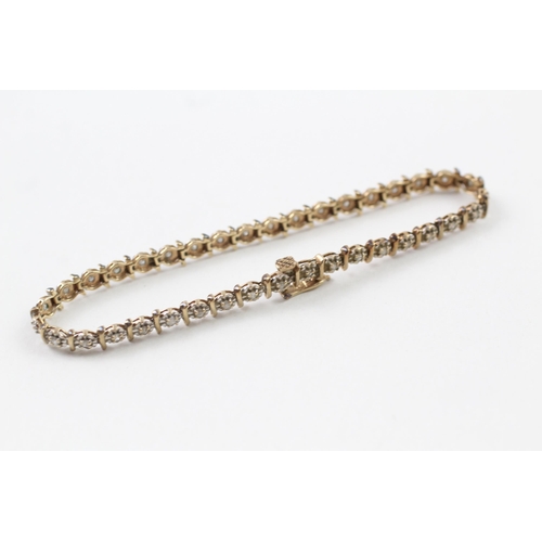 24 - 9ct gold diamond line bracelet (7g)