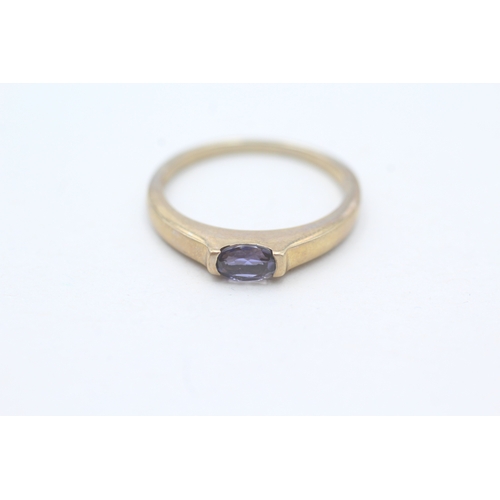 51 - 9ct gold oval cut iolite solitaire ring (1.9g) Size N 1/2