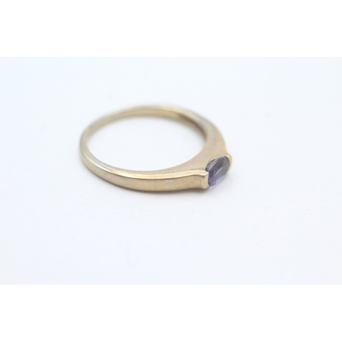 51 - 9ct gold oval cut iolite solitaire ring (1.9g) Size N 1/2