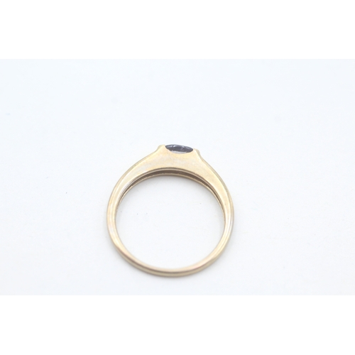 51 - 9ct gold oval cut iolite solitaire ring (1.9g) Size N 1/2