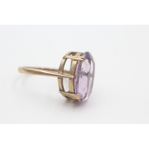 64 - 9ct gold amethyst cocktail ring (5.6g) Size O