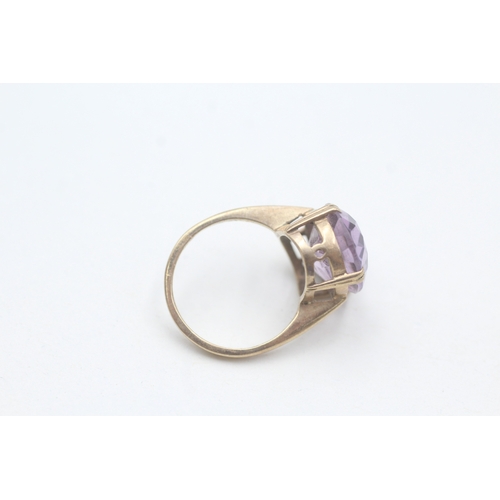 64 - 9ct gold amethyst cocktail ring (5.6g) Size O