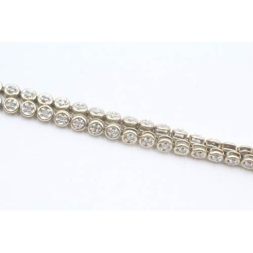 17 - 9ct gold diamond line bracelet (5.6g)