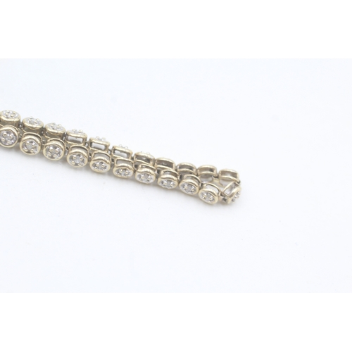 17 - 9ct gold diamond line bracelet (5.6g)