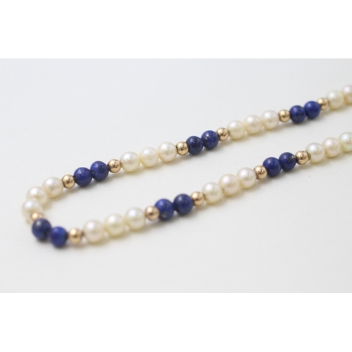 29 - 9ct gold clasped and beaded cultured pearl and lapis lazuli bead necklace (14.7g)