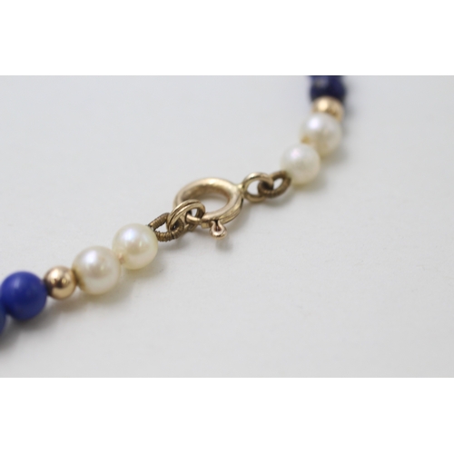 29 - 9ct gold clasped and beaded cultured pearl and lapis lazuli bead necklace (14.7g)