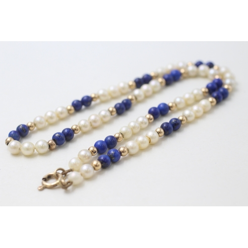 29 - 9ct gold clasped and beaded cultured pearl and lapis lazuli bead necklace (14.7g)