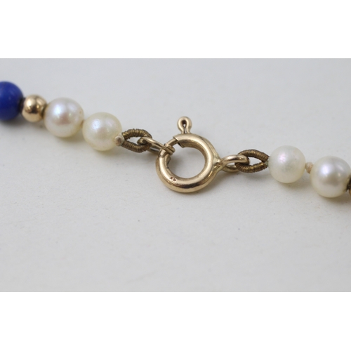 29 - 9ct gold clasped and beaded cultured pearl and lapis lazuli bead necklace (14.7g)