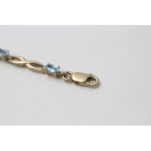 40 - 9ct gold topaz bracelet (5g)