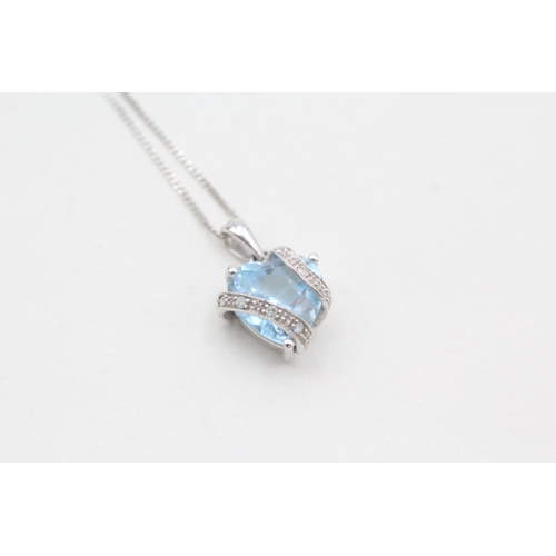 41 - 9ct white gold diamond & topaz heart pendant necklace (2.3g)