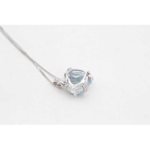 41 - 9ct white gold diamond & topaz heart pendant necklace (2.3g)