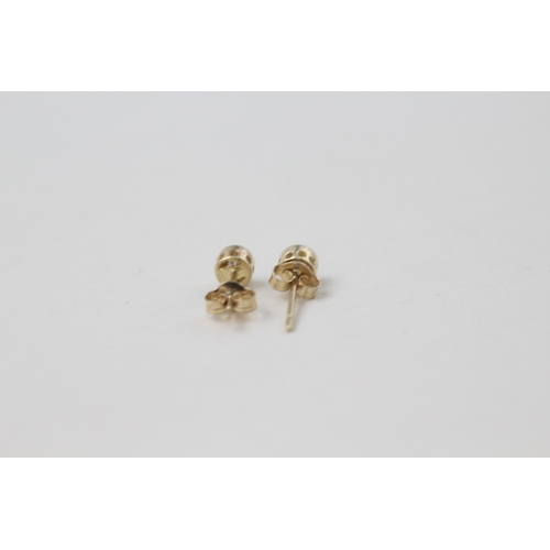 56 - 9ct gold illusion set diamond solitaire stud earrings (0.5g)