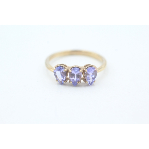 65 - 9ct gold pear cut tanzanite trilogy ring (1.7g) Size  O