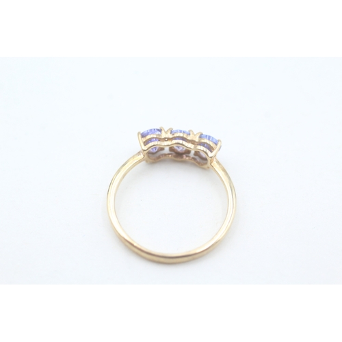 65 - 9ct gold pear cut tanzanite trilogy ring (1.7g) Size  O