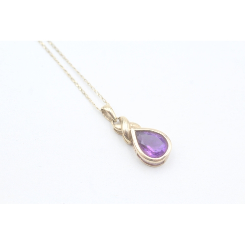 66 - 9ct gold pear cut amethyst pendant necklace (2.1g)