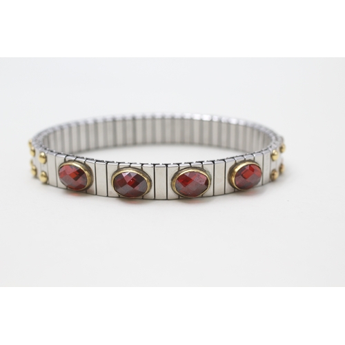 101 - 18ct gold & stainless steel faceted garnet charm bracelet by Nominahim (21.3g)