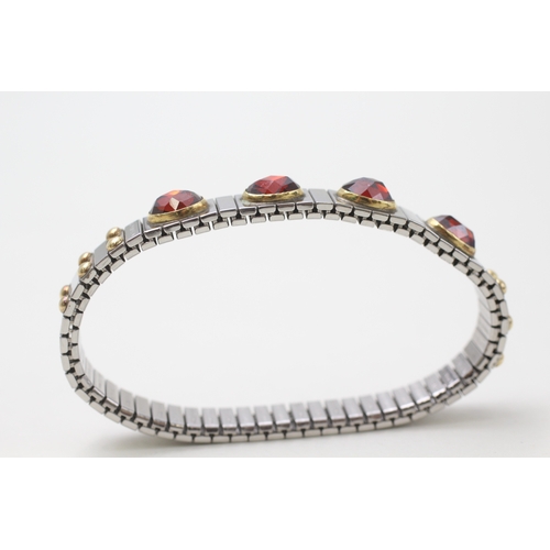 101 - 18ct gold & stainless steel faceted garnet charm bracelet by Nominahim (21.3g)