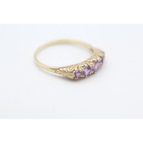 107 - 9ct gold amethyst five stone ring with patterned gallery (2.2g) Size S 1/2