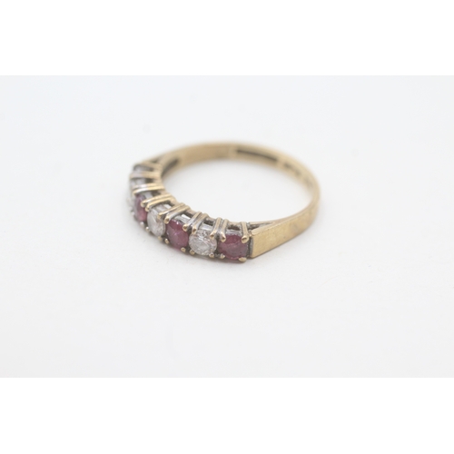 121 - 9ct gold ruby & cubic zirconia half eternity ring (1.8g) Size L