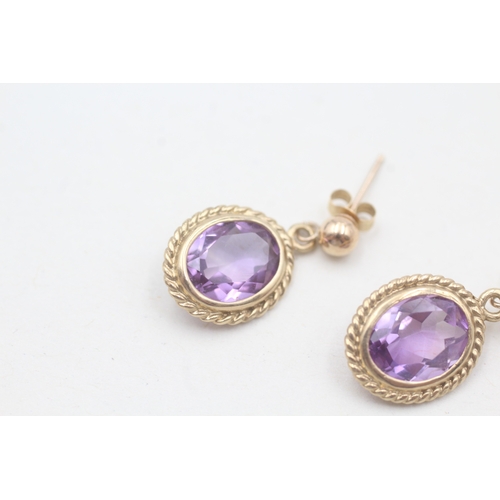 131 - 9ct gold amethyst drop earrings (2.4g)