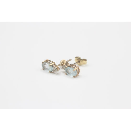 163 - 9ct gold blue topaz & diamond stud earrings (0.9g)