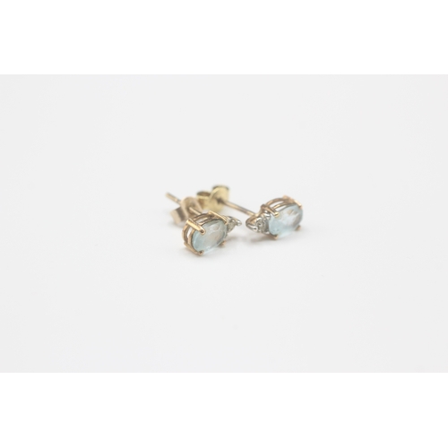 163 - 9ct gold blue topaz & diamond stud earrings (0.9g)