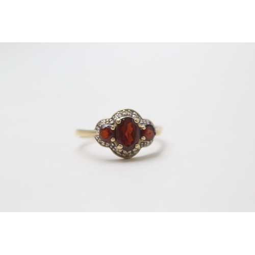 195 - 9ct gold garnet & diamond dress ring (1.9g) AS SEEN - MISSHAPEN Size O