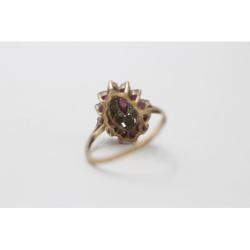 37 - 9ct gold ruby & diamond dress ring (2.1g) AS SEEN - MISSHAPEN Size M