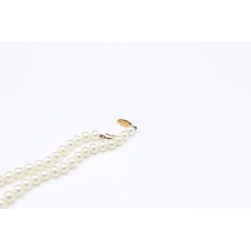 49 - 14ct gold cultured pearl necklace (16g)