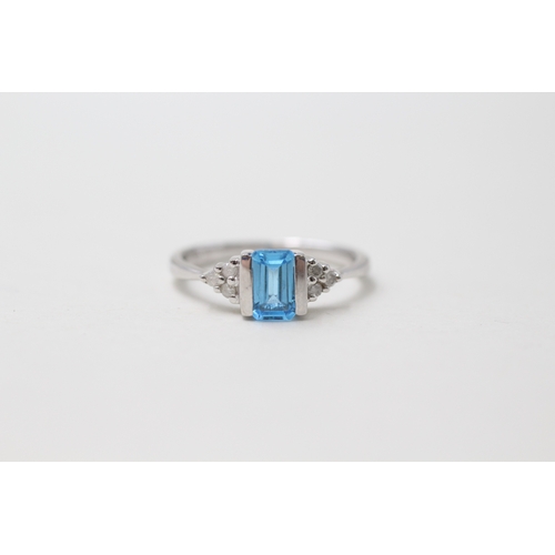 55 - 9ct gold blue topaz & diamond dress ring (2.1g) Size K