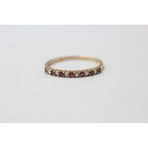 70 - 9ct gold ruby & diamond half eternity ring (1g) Size M