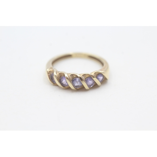 83 - 9ct gold tanzanite half eternity ring (2g) Size J 1/2