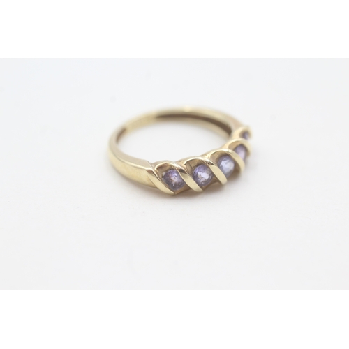 83 - 9ct gold tanzanite half eternity ring (2g) Size J 1/2