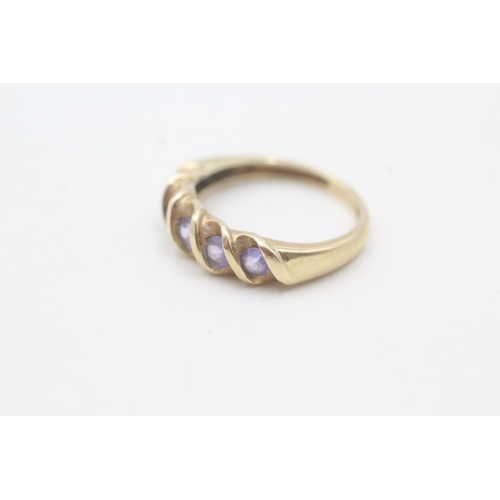 83 - 9ct gold tanzanite half eternity ring (2g) Size J 1/2