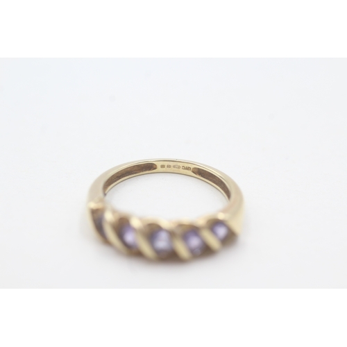 83 - 9ct gold tanzanite half eternity ring (2g) Size J 1/2