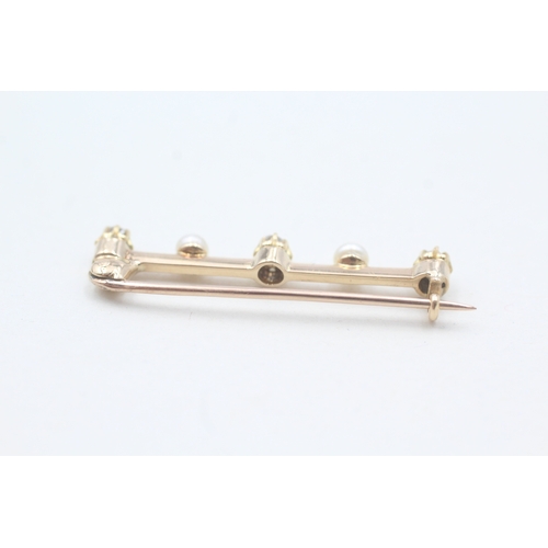 87 - 15ct gold diamond & pearl bar brooch with a 9ct gold pin (2g)