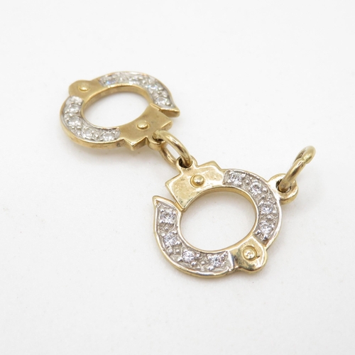 214 - HM 9ct Handcuffs Charm - 3.24g