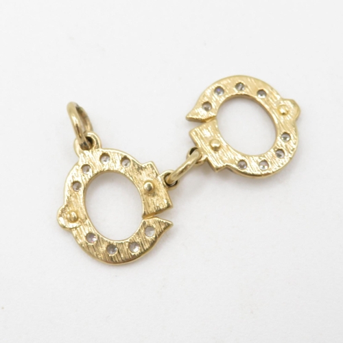 214 - HM 9ct Handcuffs Charm - 3.24g