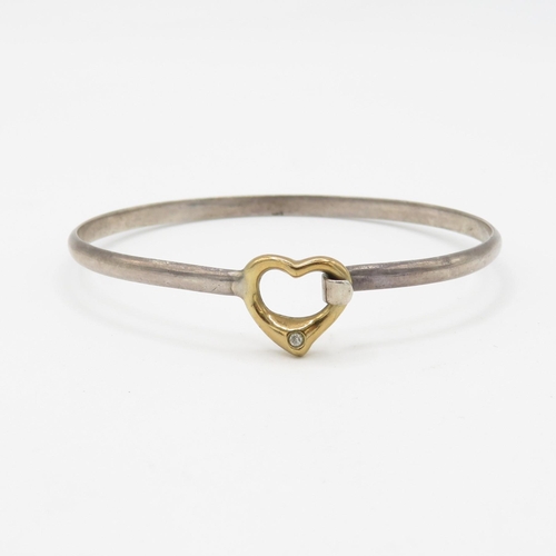 71 - 9ct gold & silver heart shape diamond bangle (9.2g)