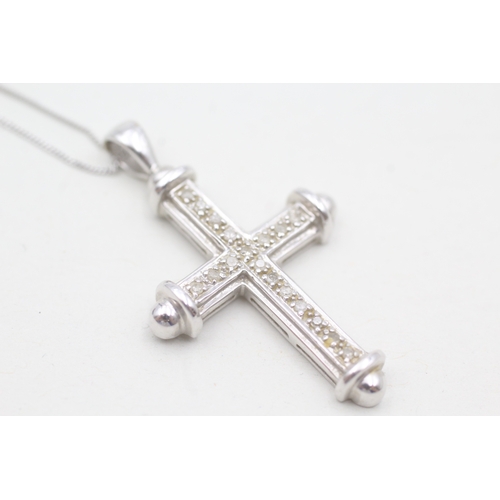 102 - 9ct white gold diamond cross pendant necklace (3.5g)