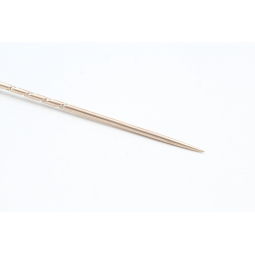 118 - 9ct gold antique turquoise stick pin (1.4g)