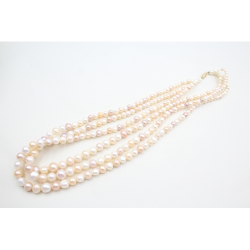 39 - 14ct gold pearl three strand necklace (78g)