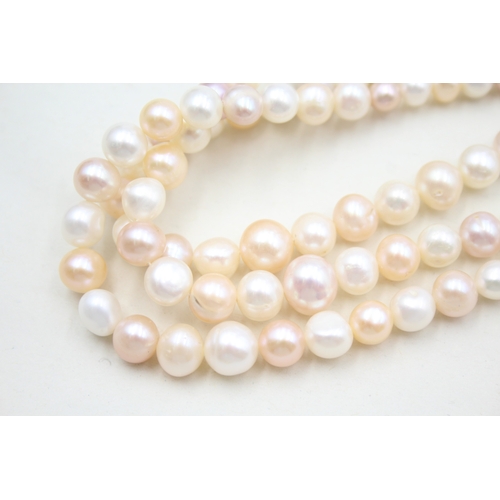 39 - 14ct gold pearl three strand necklace (78g)