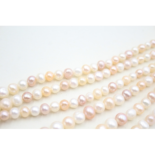 39 - 14ct gold pearl three strand necklace (78g)