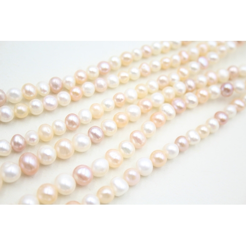 39 - 14ct gold pearl three strand necklace (78g)