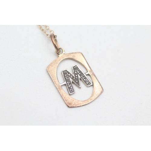 45 - 9ct gold diamond initial 'M' pendant with 9ct gold chain (1.8g)